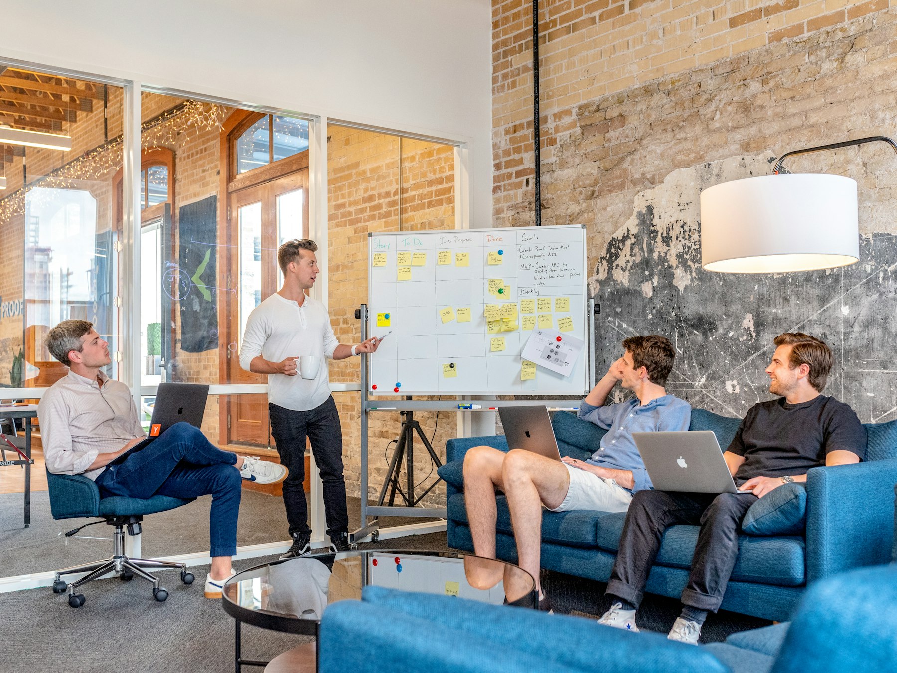 Consultant presenting a plan to a team in a bright office